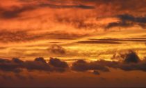 A golden sun sets over the East China Sea, near Okinawa, Japan